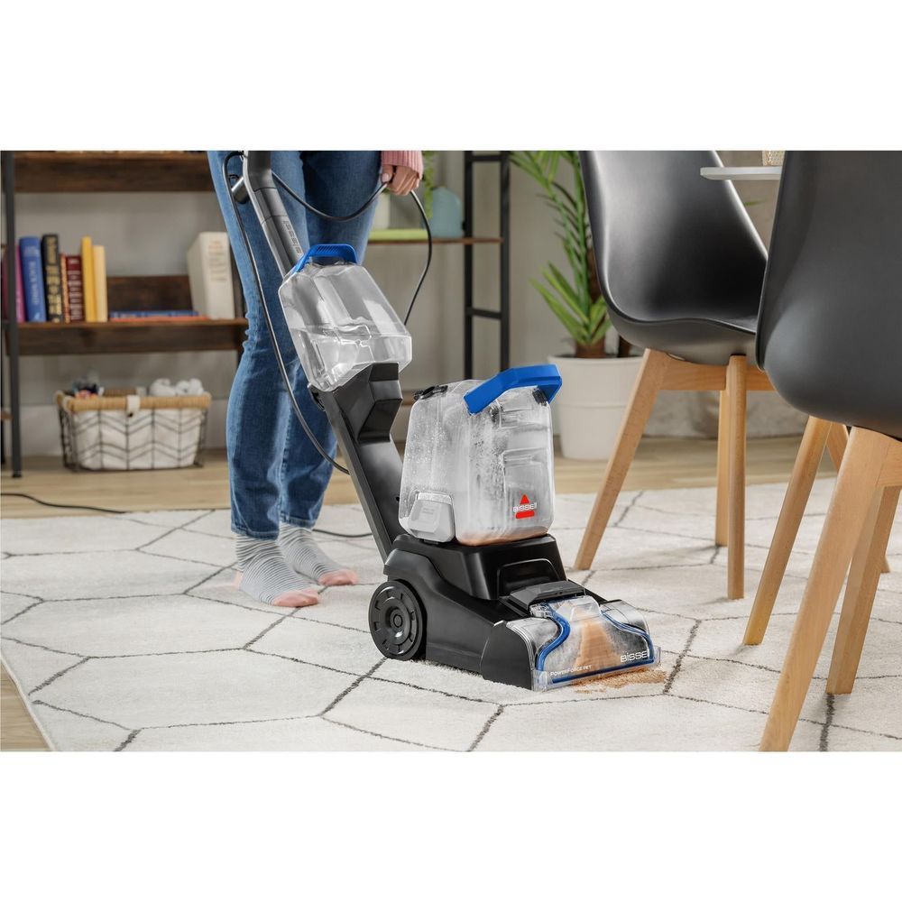Upright carpet cleaner cleaning tile floor, blue and clear front nozzle for spot work