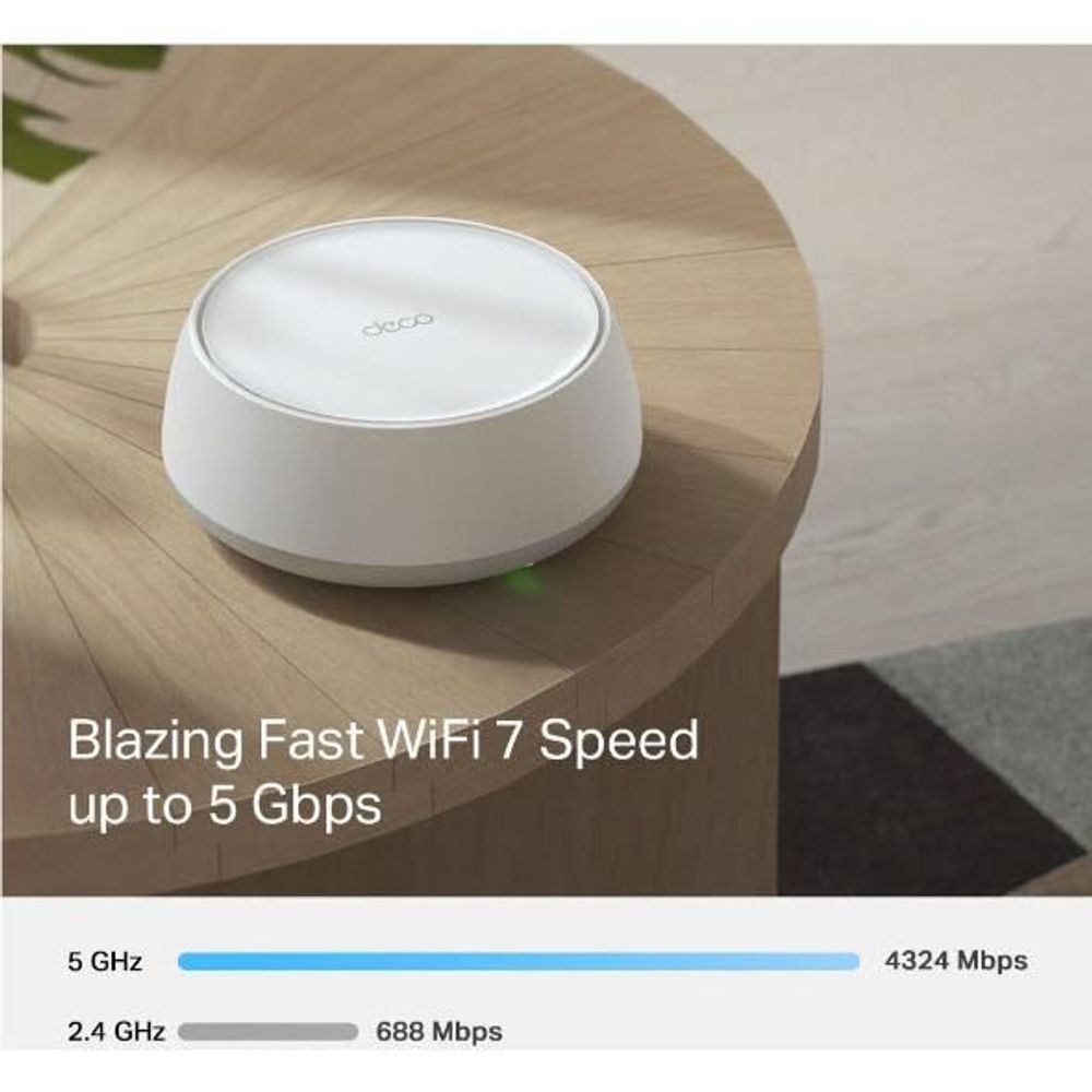 White TP-Link Deco mesh Wi-Fi 7 router placed on a wood tabletop