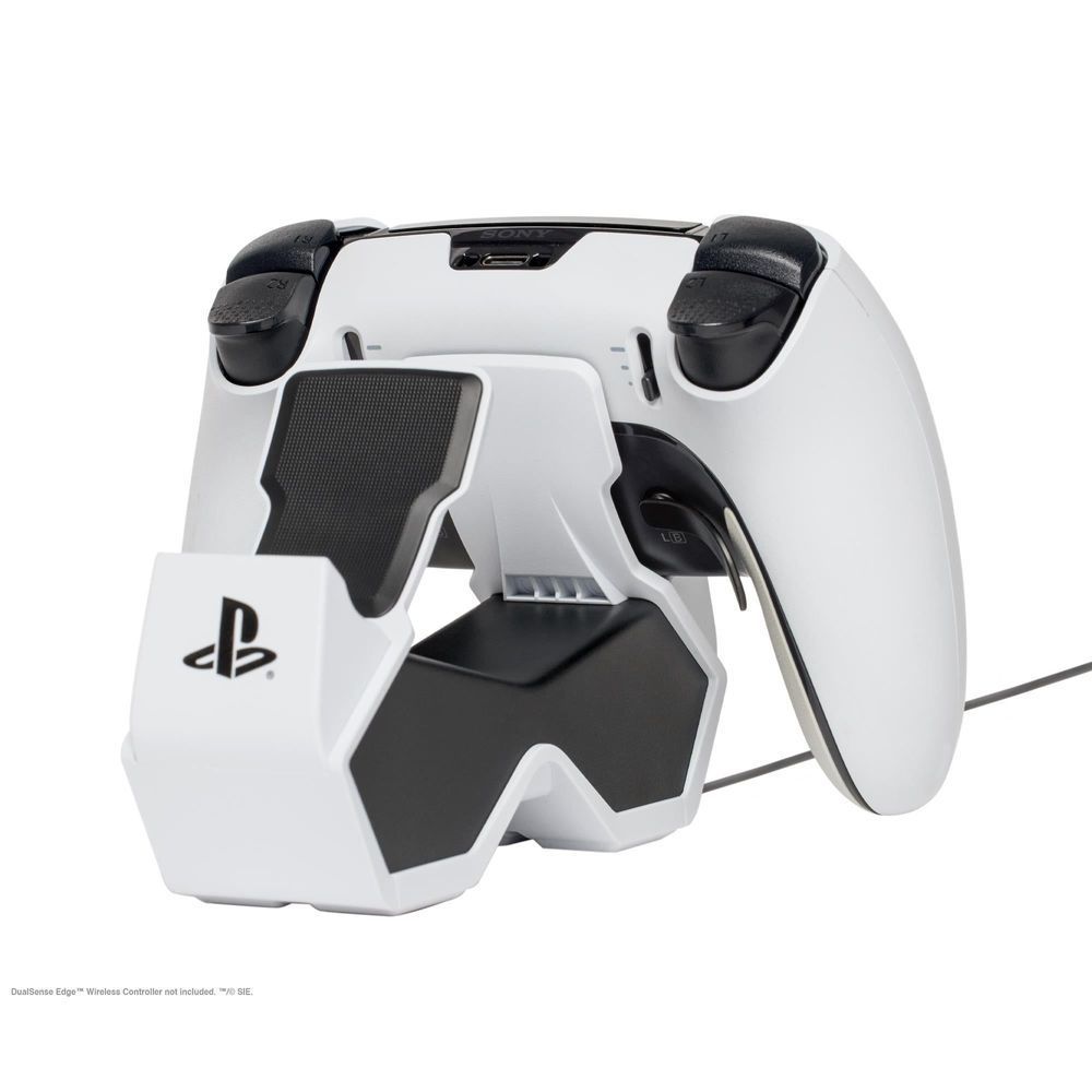 White twin charging station with two PS5 controllers docked, charging pads exposed