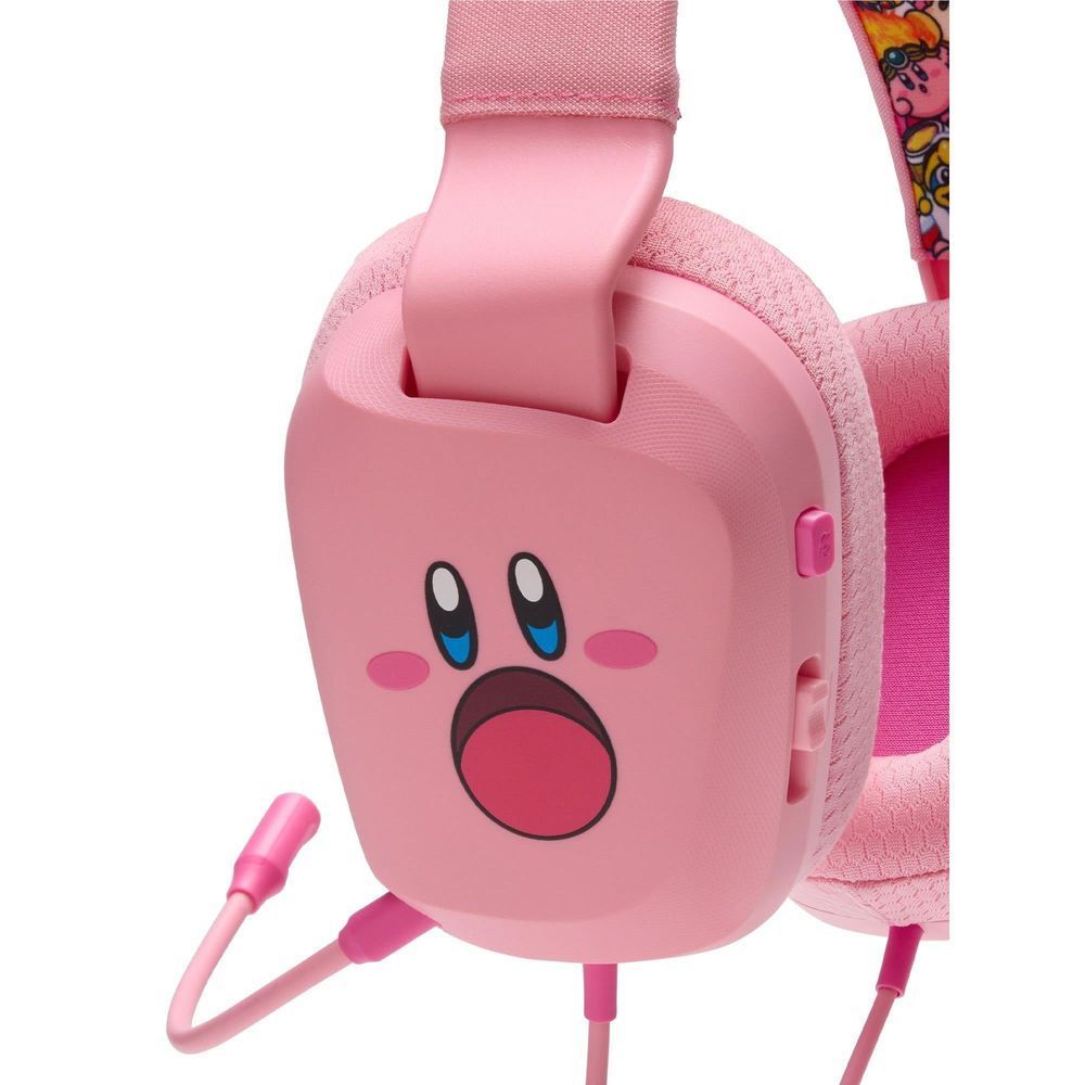Light pink wired headset earcup close-up with large Kirby mouth face graphic