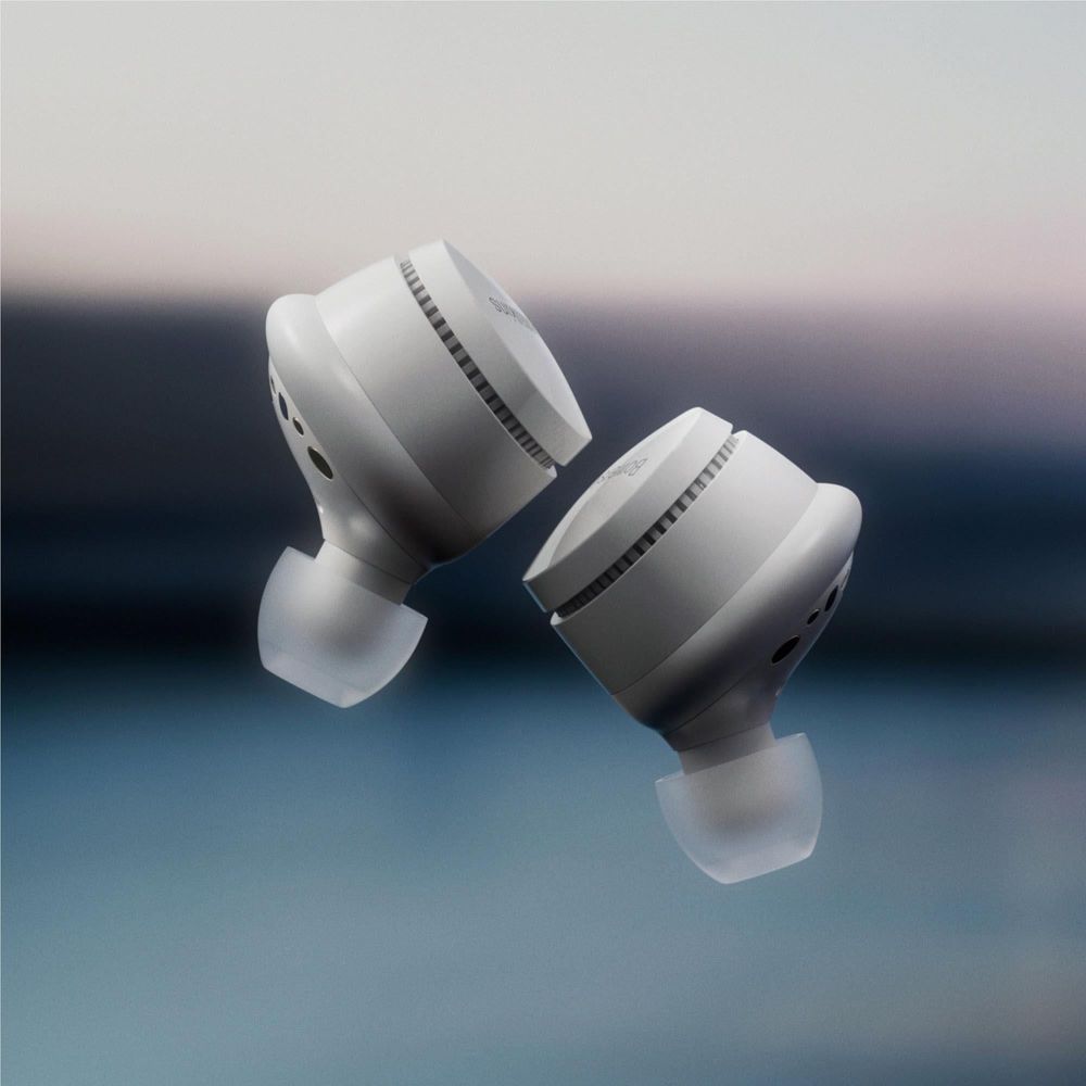 Cloud grey wireless earbuds, angled view, silicone tips