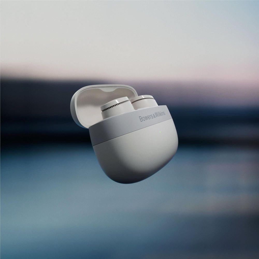 Cloud grey charging case with earbuds partially inside
