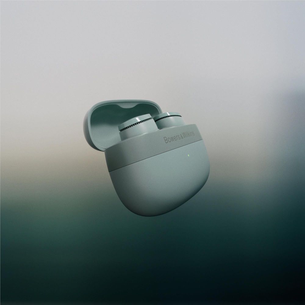 Forest green earbuds partially in charging case