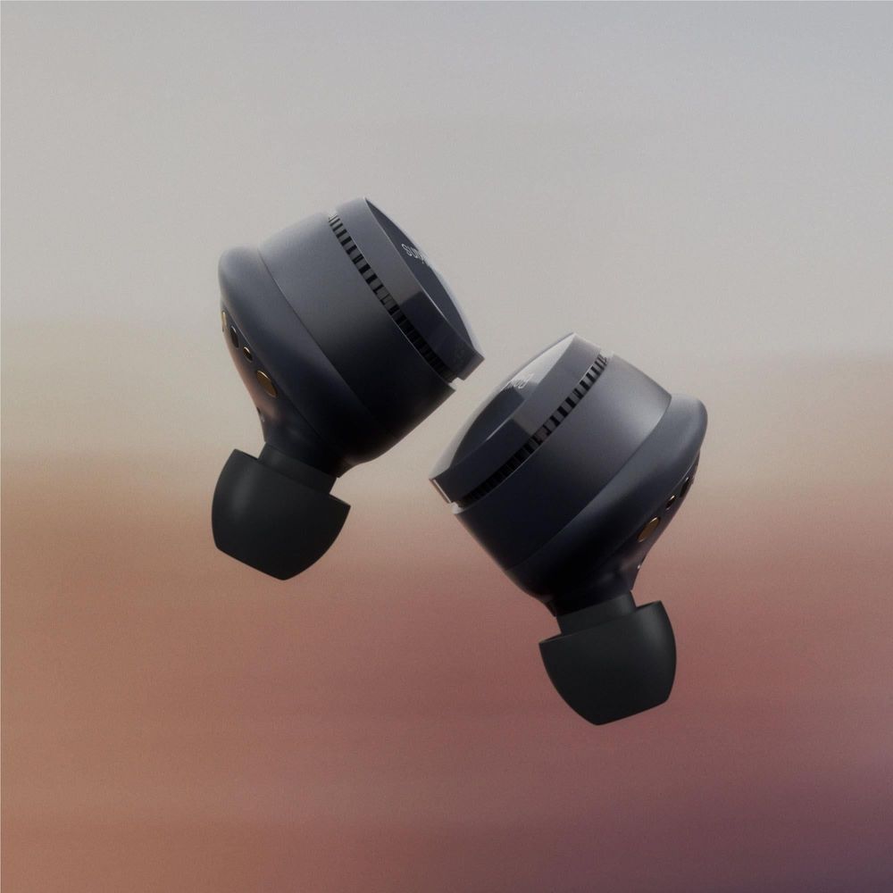 Storm grey PI6 ANC TWS earbuds with silicone tips, angled front view
