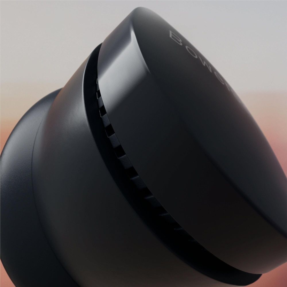 Storm grey PI6 ANC TWS earbud close-up with textured side vents