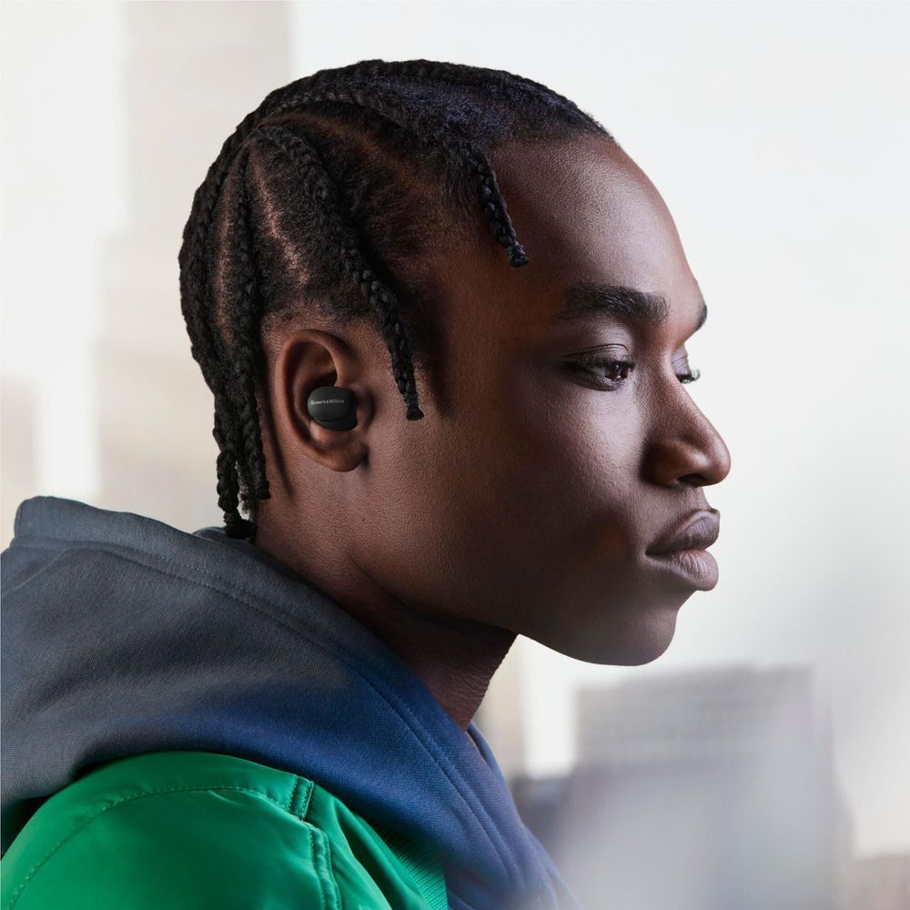 Storm grey PI6 ANC TWS earbud in ear, side profile