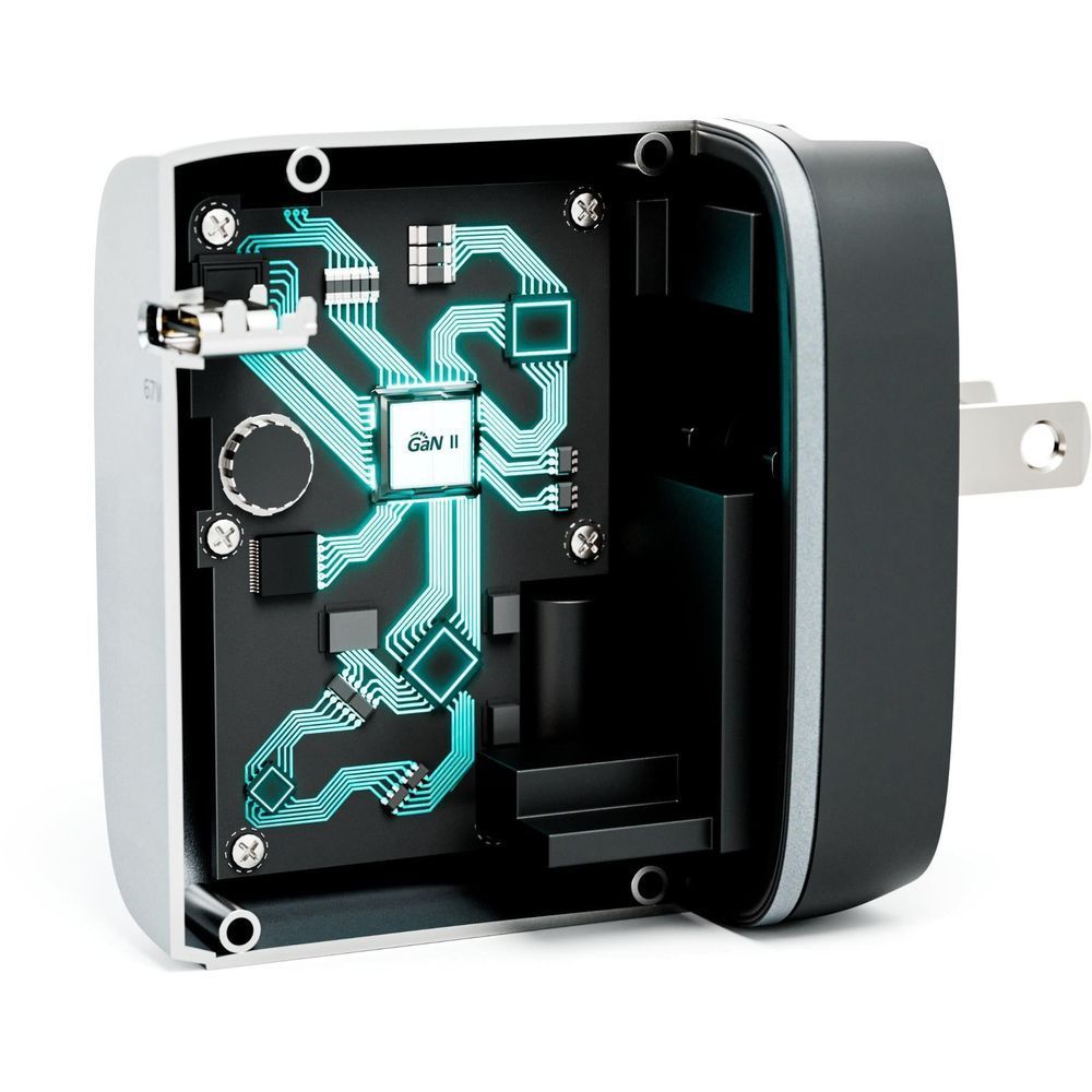 Space grey travel charger with open electronics panel showing circuit board