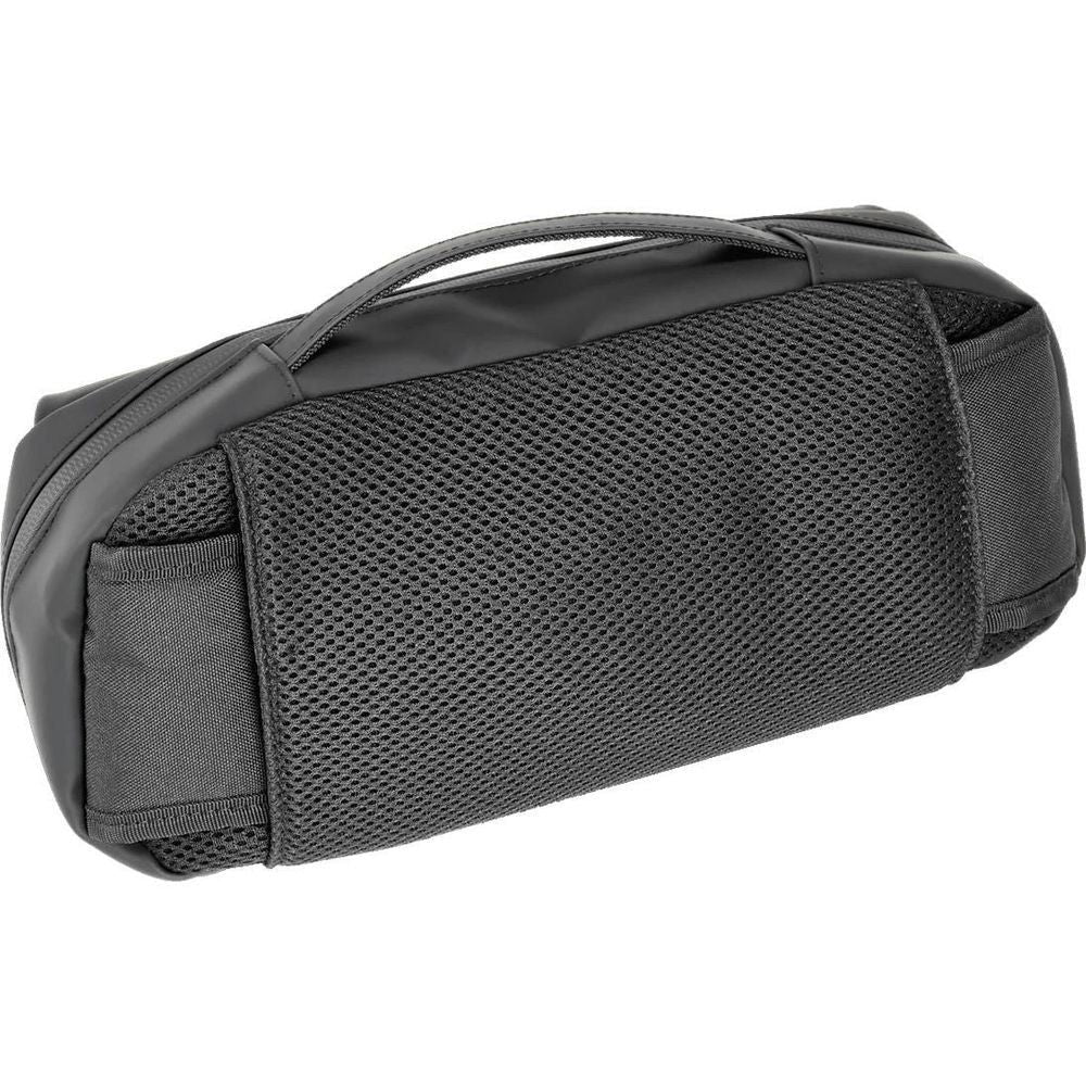 Black textured adventure pack with reinforced edges and top carry handle