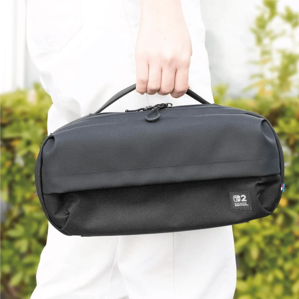 Black adventure pack for Nintendo Switch 2 with top handle and front zipper pocket