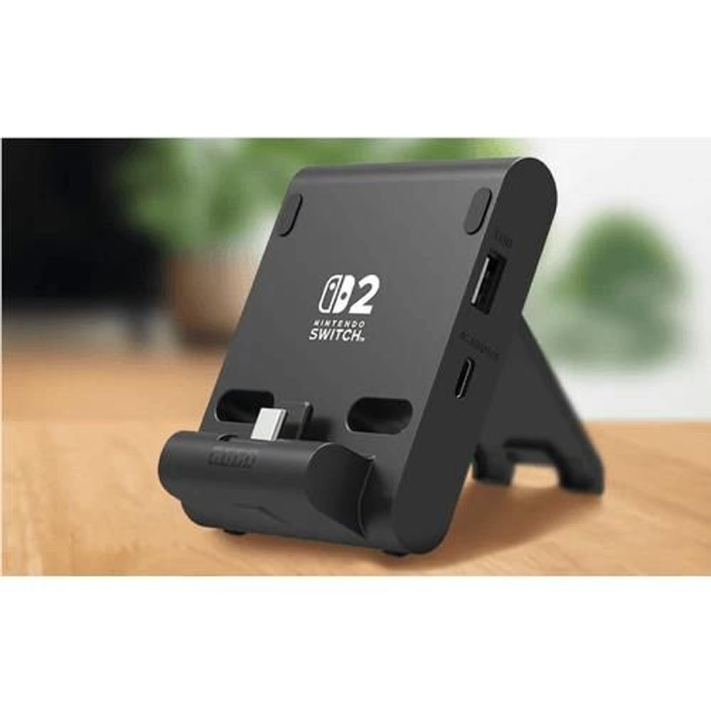 Black Nintendo Switch play stand on tabletop, angled cradle with support pads