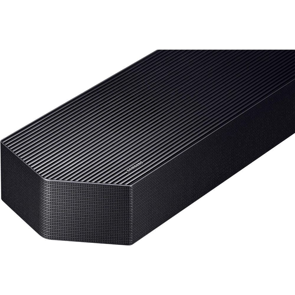 Black soundbar speaker grille close-up with diagonal fabric texture