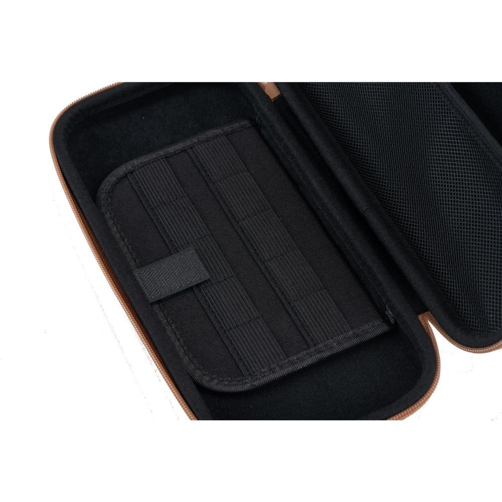 Brown case interior with black fabric lining and stitched organizer panel