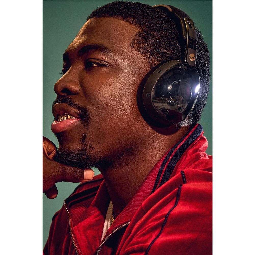 Black over-ear ANC headphones worn, featuring cushioned headband and earcups