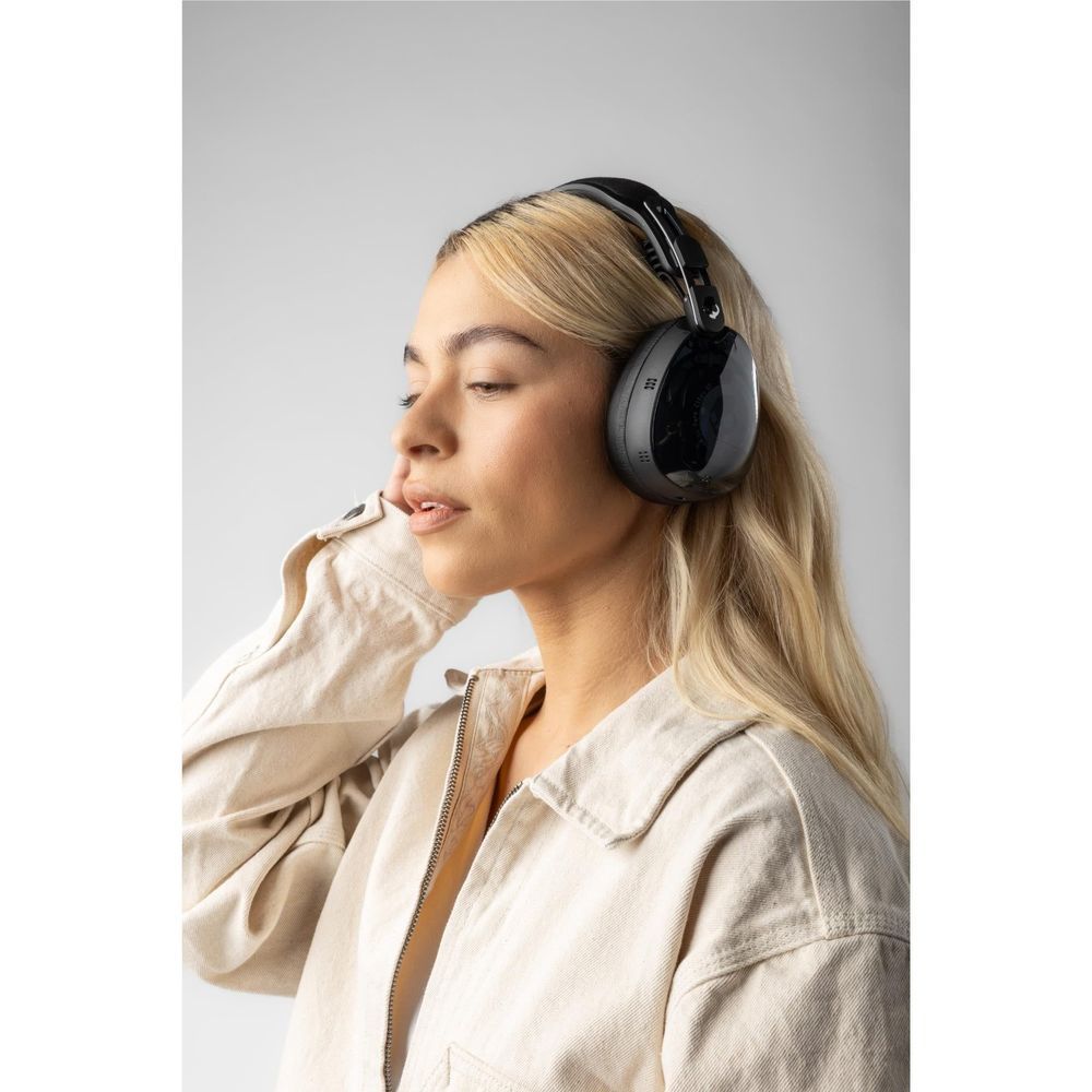 Black over-ear active noise cancelling headphones worn with adjustable headband