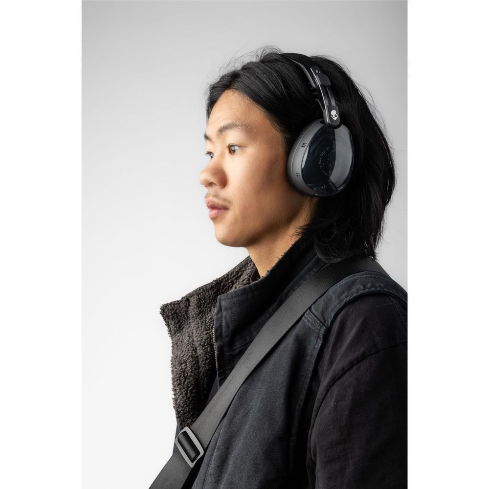 Black over-ear headphones with padded earcups worn on head