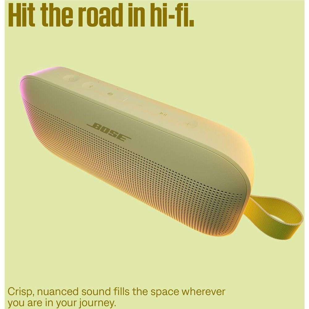 Citrus yellow portable speaker in angled view with lime carry strap