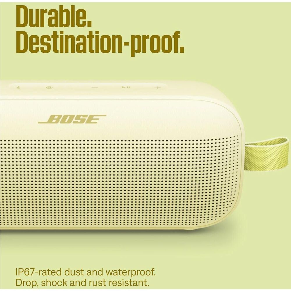 Citrus yellow portable speaker close-up of speaker grille and lime carry strap