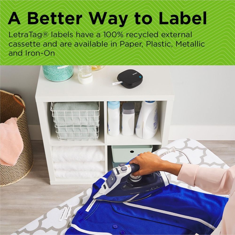 Portable DYMO LetraTag label maker with smartphone in hand nearby