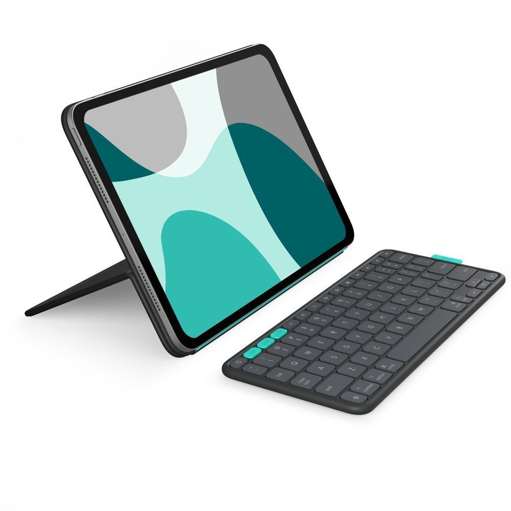 Graphite folio stand case with tablet and keyboard nearby, teal accent strip