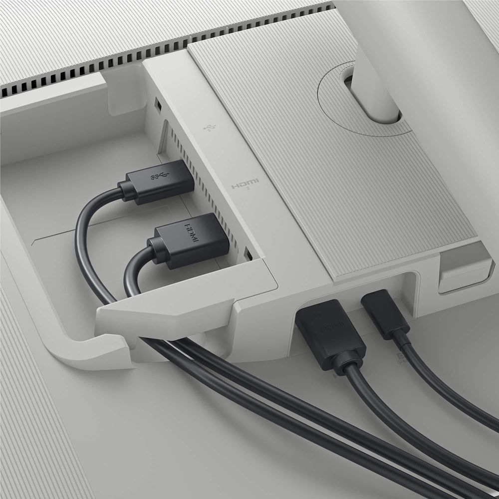 Dell monitor rear ports with connected cables inside port bay