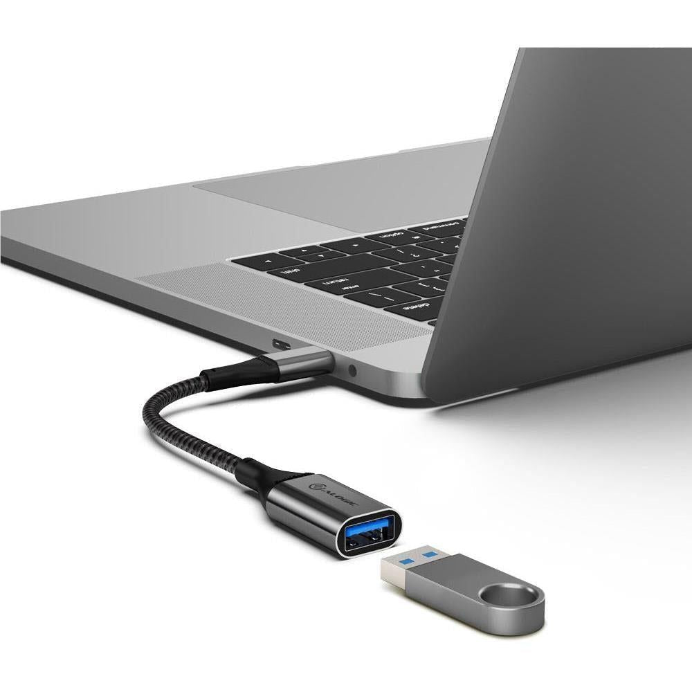 USB-C to USB-A adapter connected to a laptop with braided cable