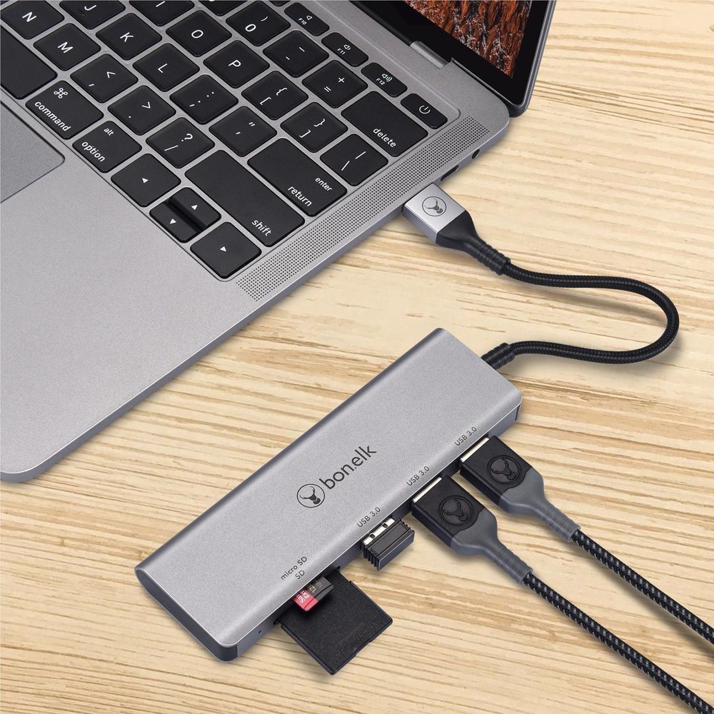 Space grey Bonelk 5-in-1 USB hub with memory card slot and USB ports on desk