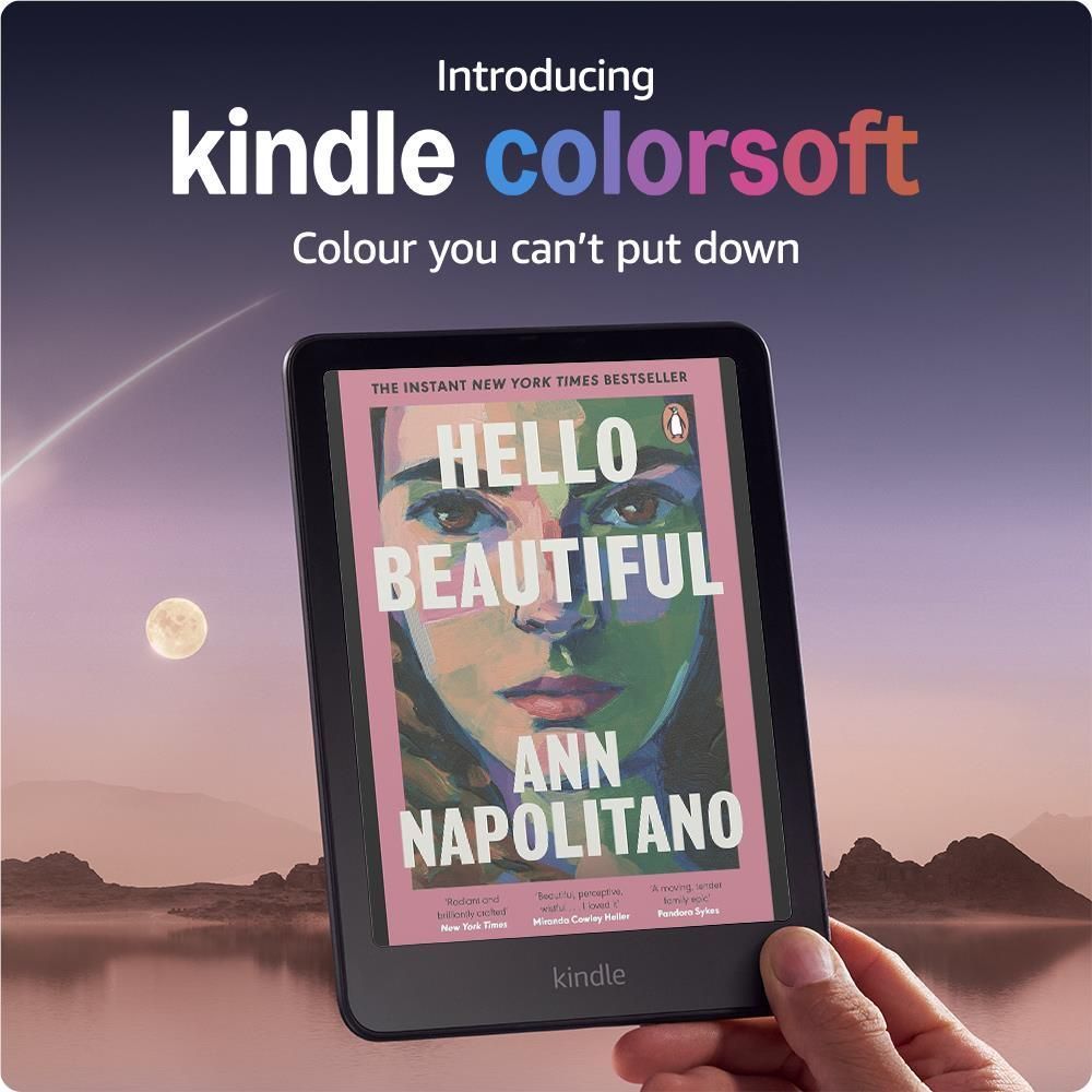 Black Kindle e-reader in hand, color display showing large book cover art