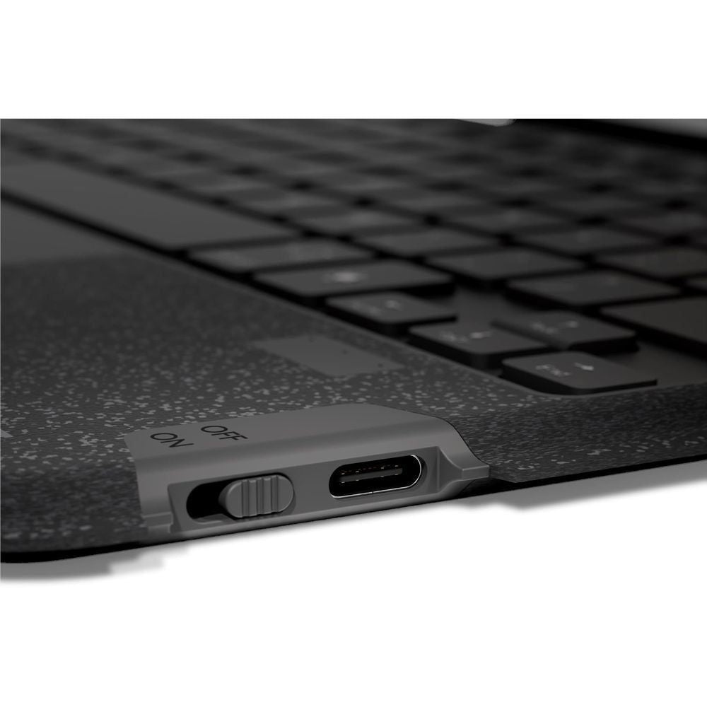 Black keyboard case side view with charging port and control button.