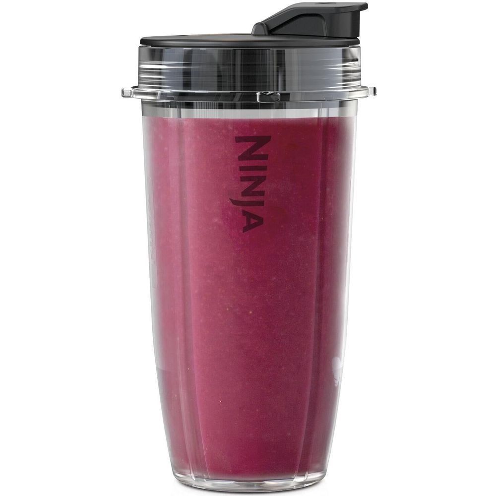 Ninja blender cup with purple smoothie inside clear blending container