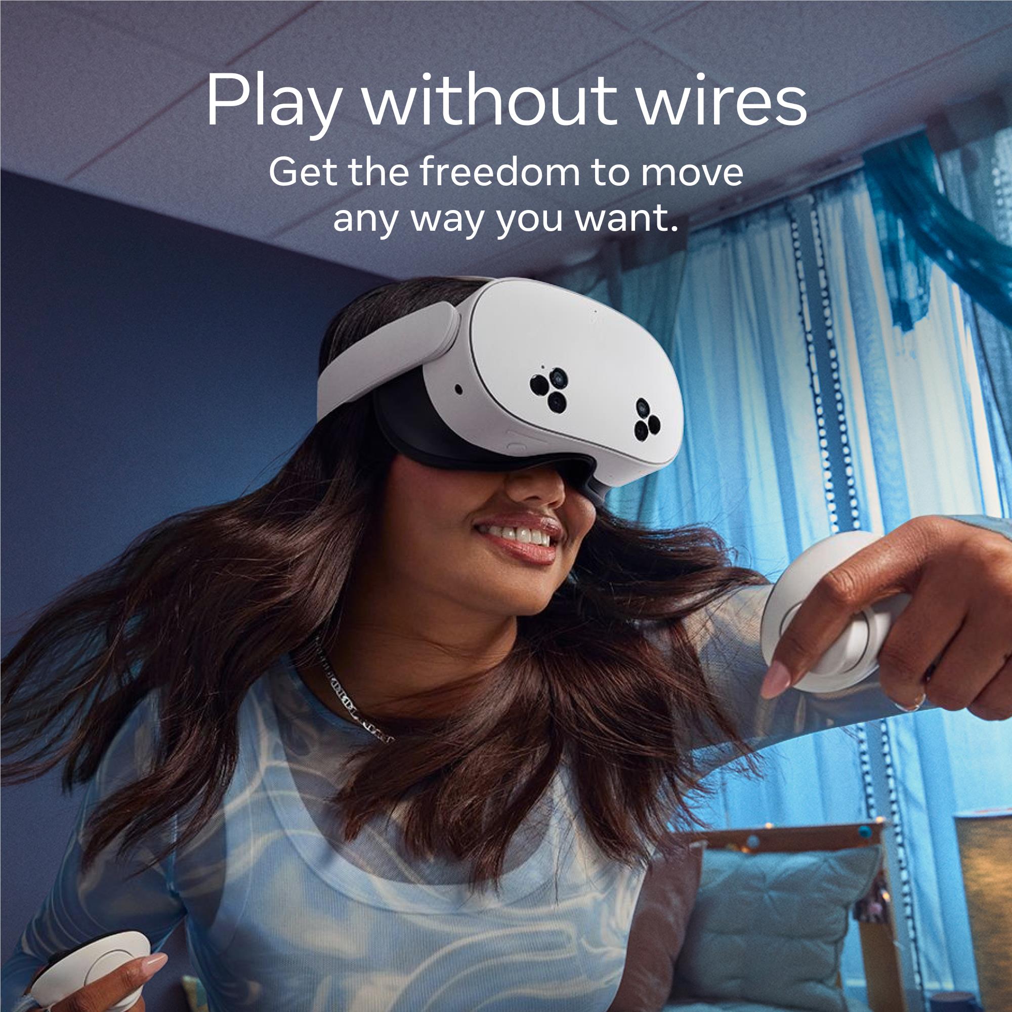 White mixed reality VR headset worn by person with handheld controller grips