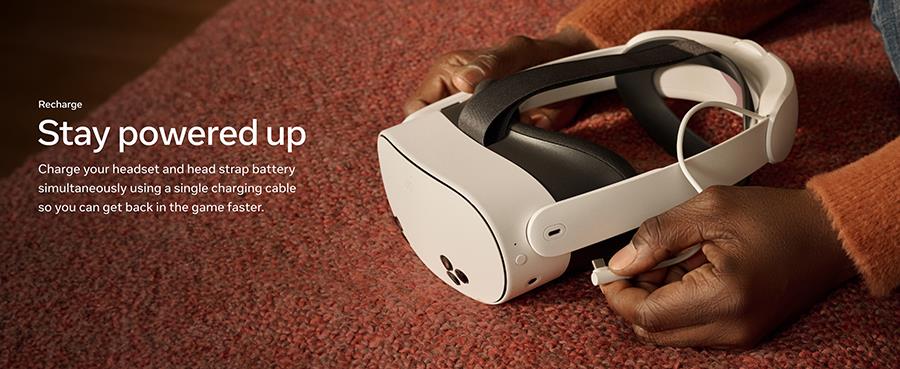 White VR headset resting on carpet with black battery band