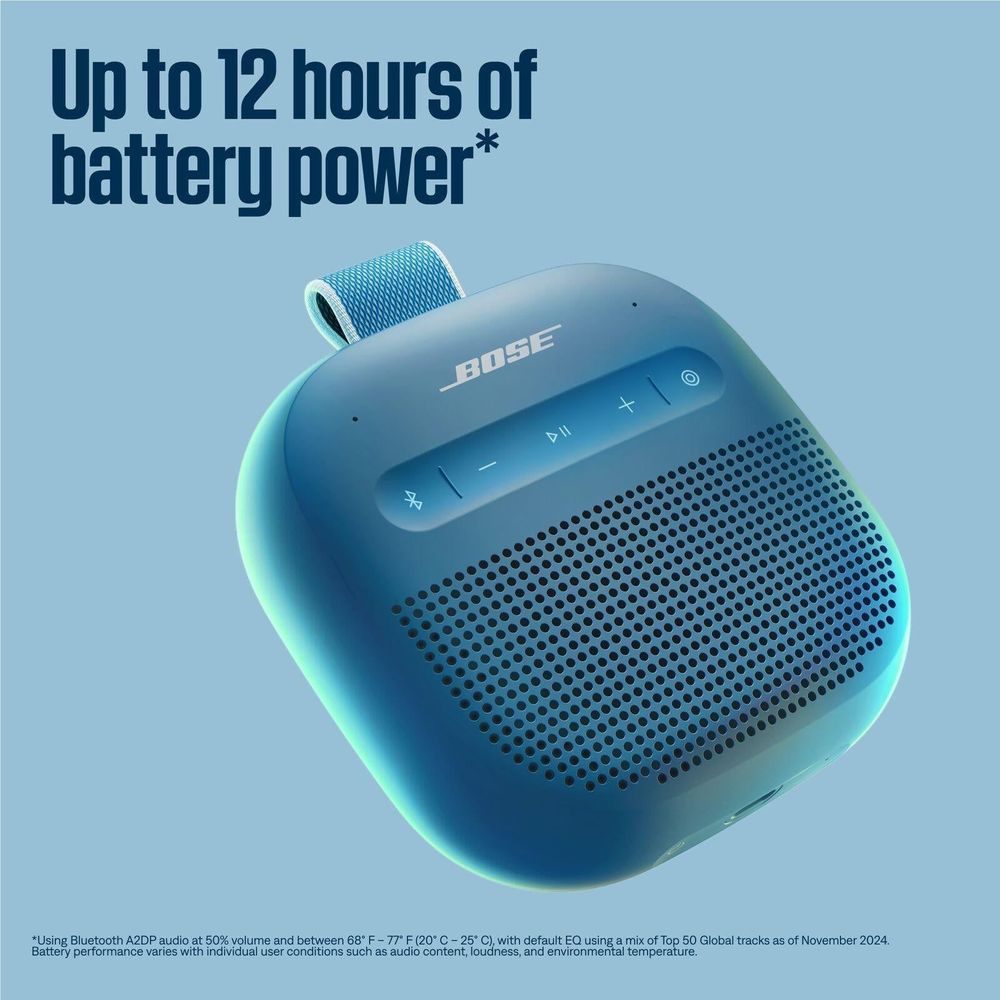 Blue Bose SoundLink Micro portable speaker with front grille and top strap