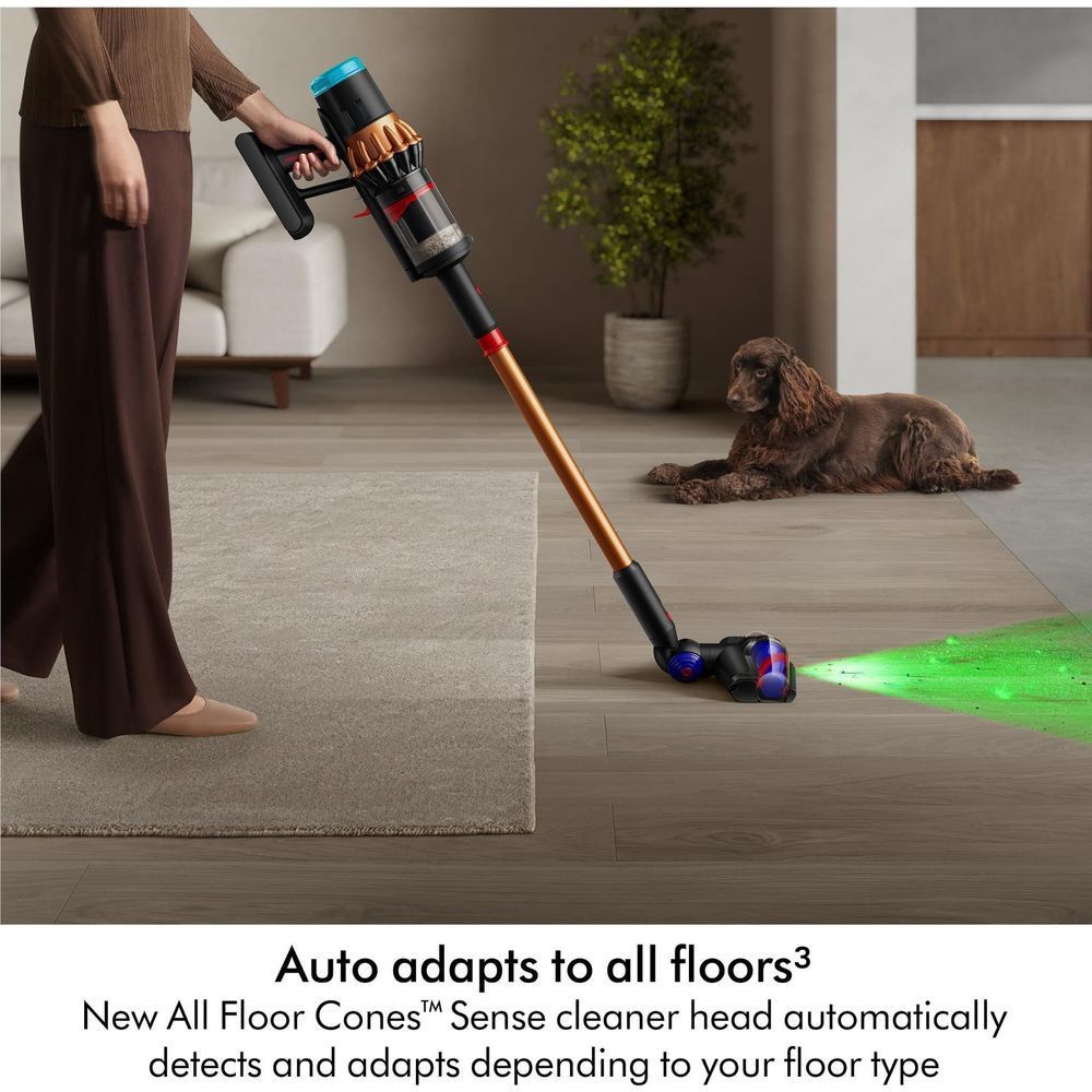 Dyson stick vacuum on hard floor with blue-red floor brush and green light beam