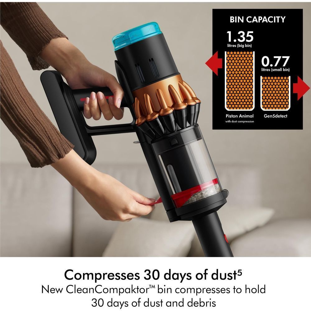 Dyson stick vacuum bin with filter cartridge, black and bronze handheld unit