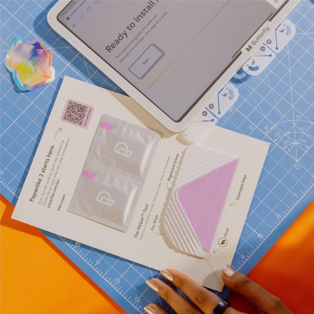 Screen protector kit with pre-cut film and installation cards beside an iPad