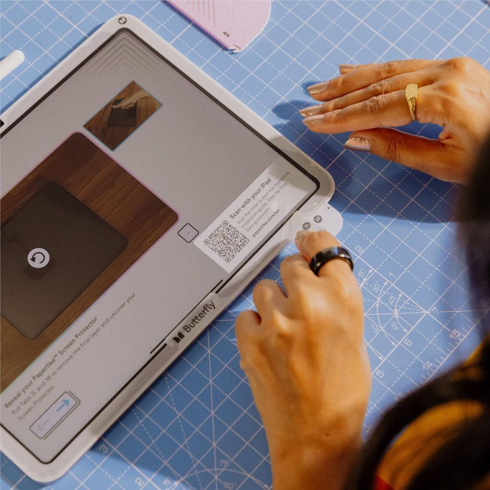 iPad screen protector corner being pressed flat with fingers