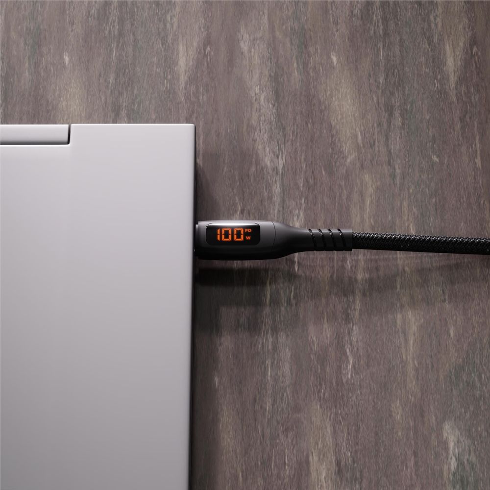 Black USB-C to USB-C cable connector with orange LED watt reading on braided cord