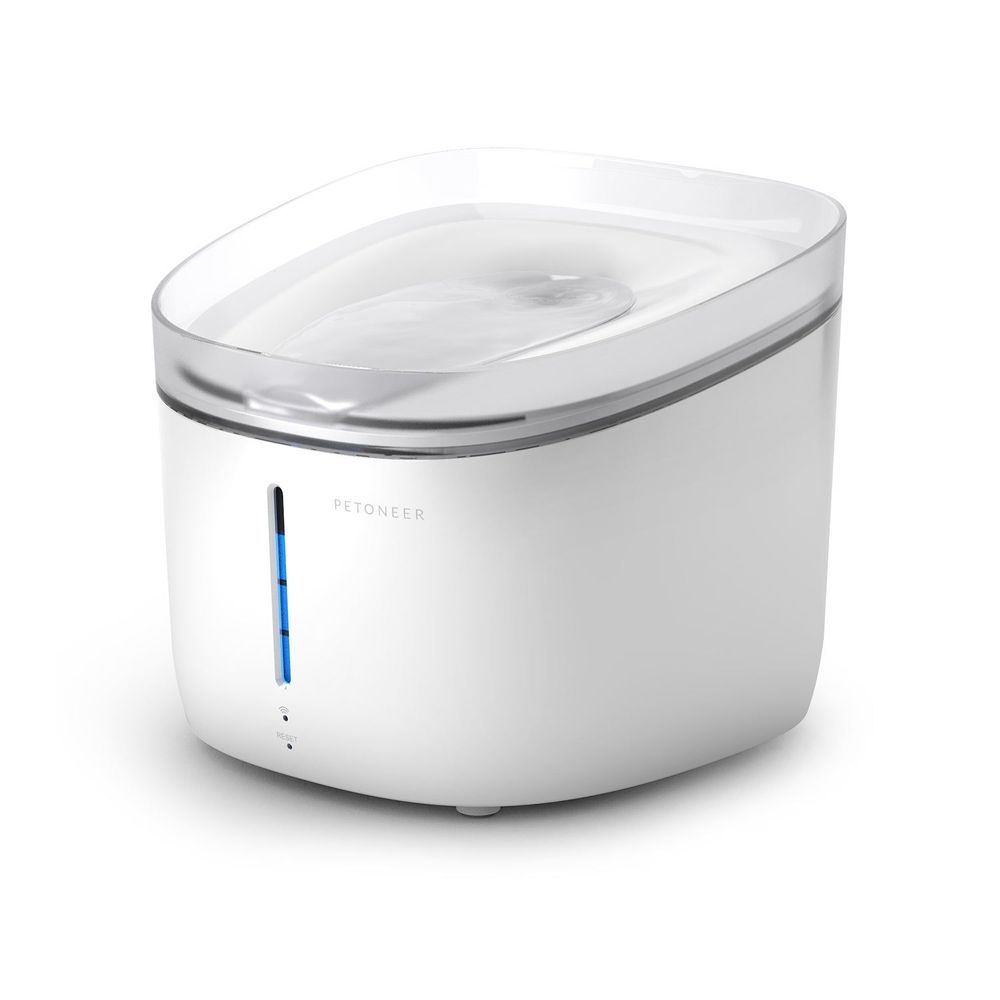 Pet water fountain with clear top reservoir and blue indicator on white housing