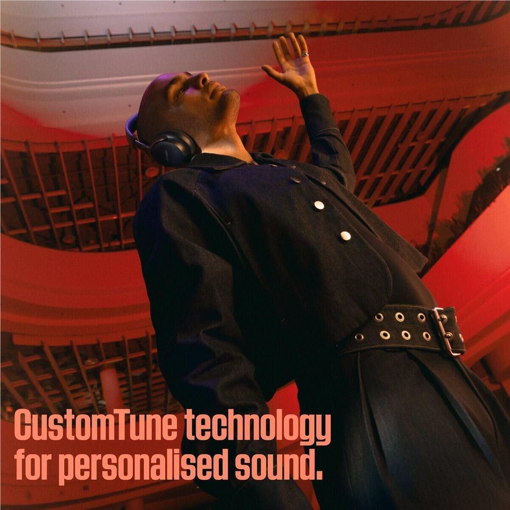 Black Bose QuietComfort Ultra headphones on head, over-ear fit
