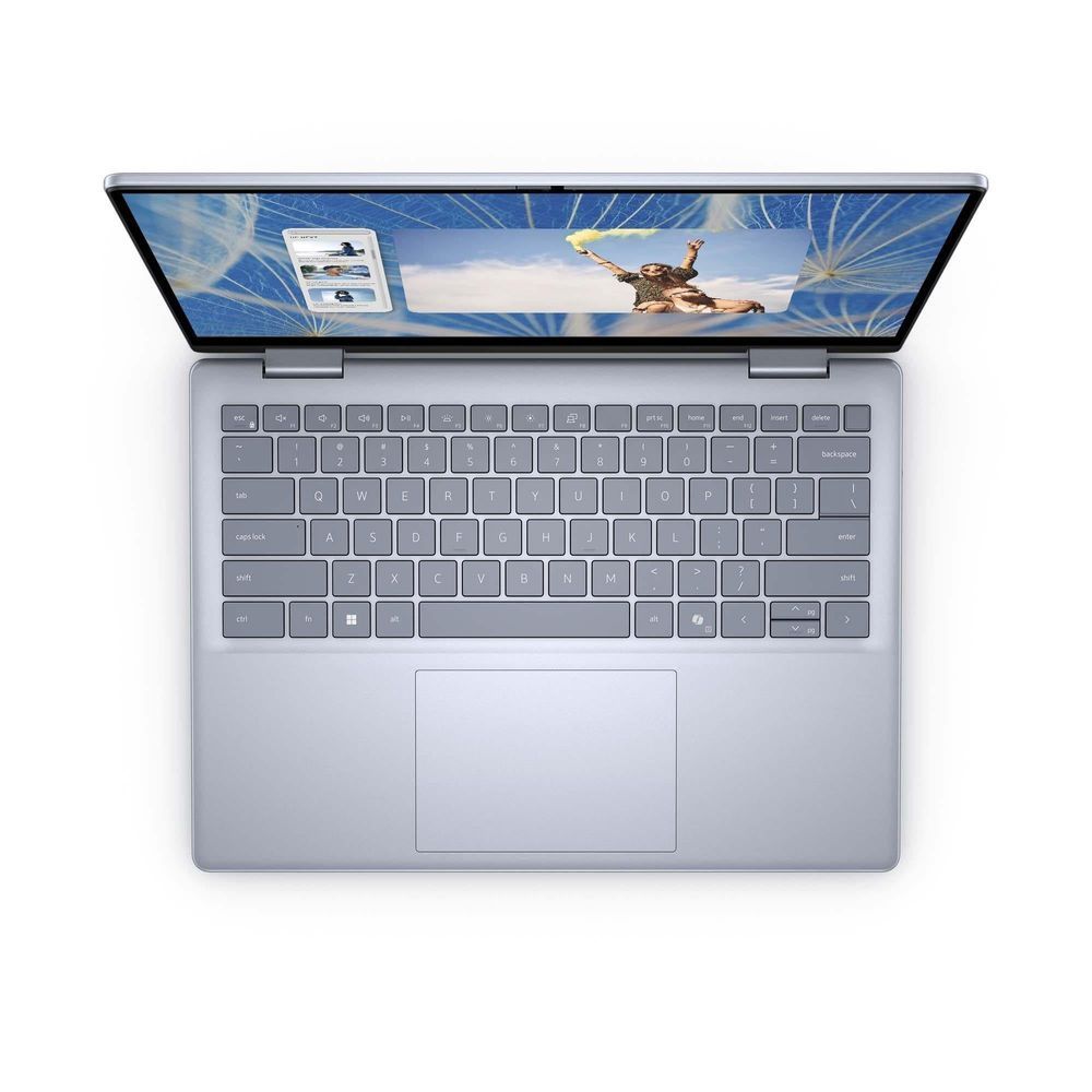 Dell Inspiron 7440 2-in-1 laptop with keyboard shown, touchpad centered, silver base