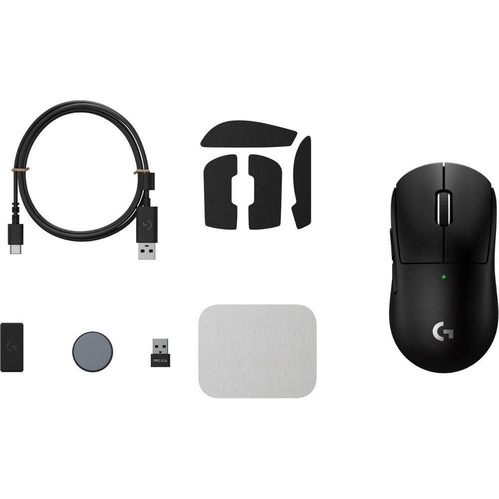 Black gaming mouse with included charging cable, USB dongle, and spare mouse feet