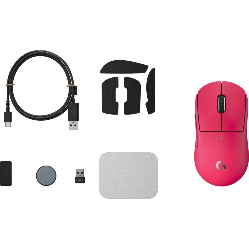 Magenta wireless gaming mouse kit with USB cable, spare feet, and adapter pieces.