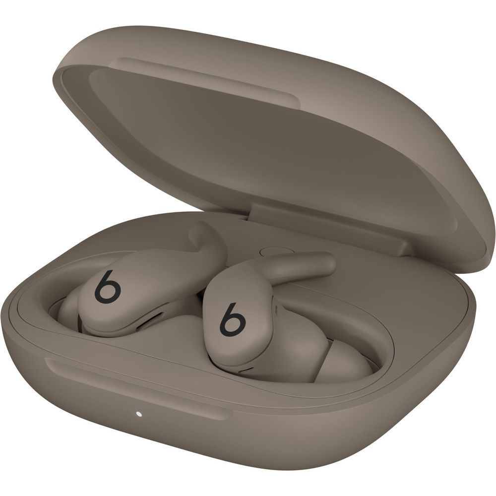 Gray wireless earbuds resting in closed charging case with lid open