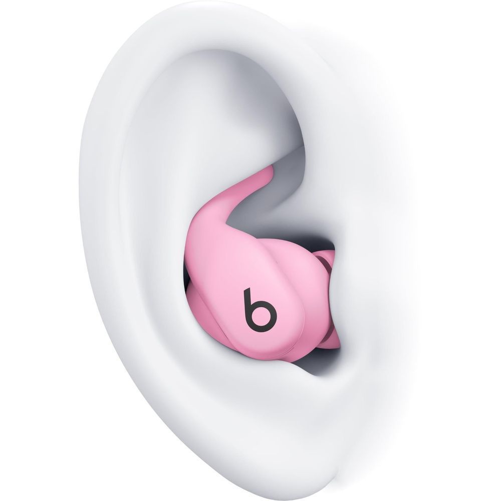 Pink wireless earbud seated in a white ear model