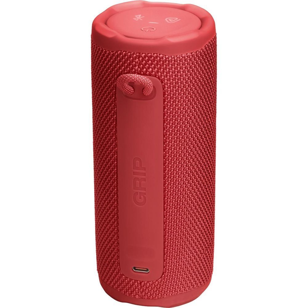 Red portable speaker with GRIP panel and bottom USB port opening