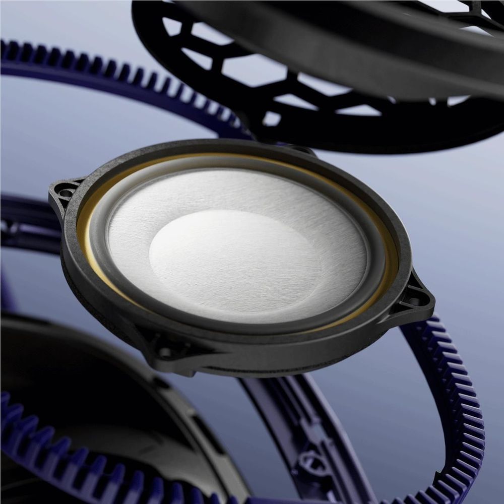 Close-up of indigo blue over-ear headphone speaker driver and grille