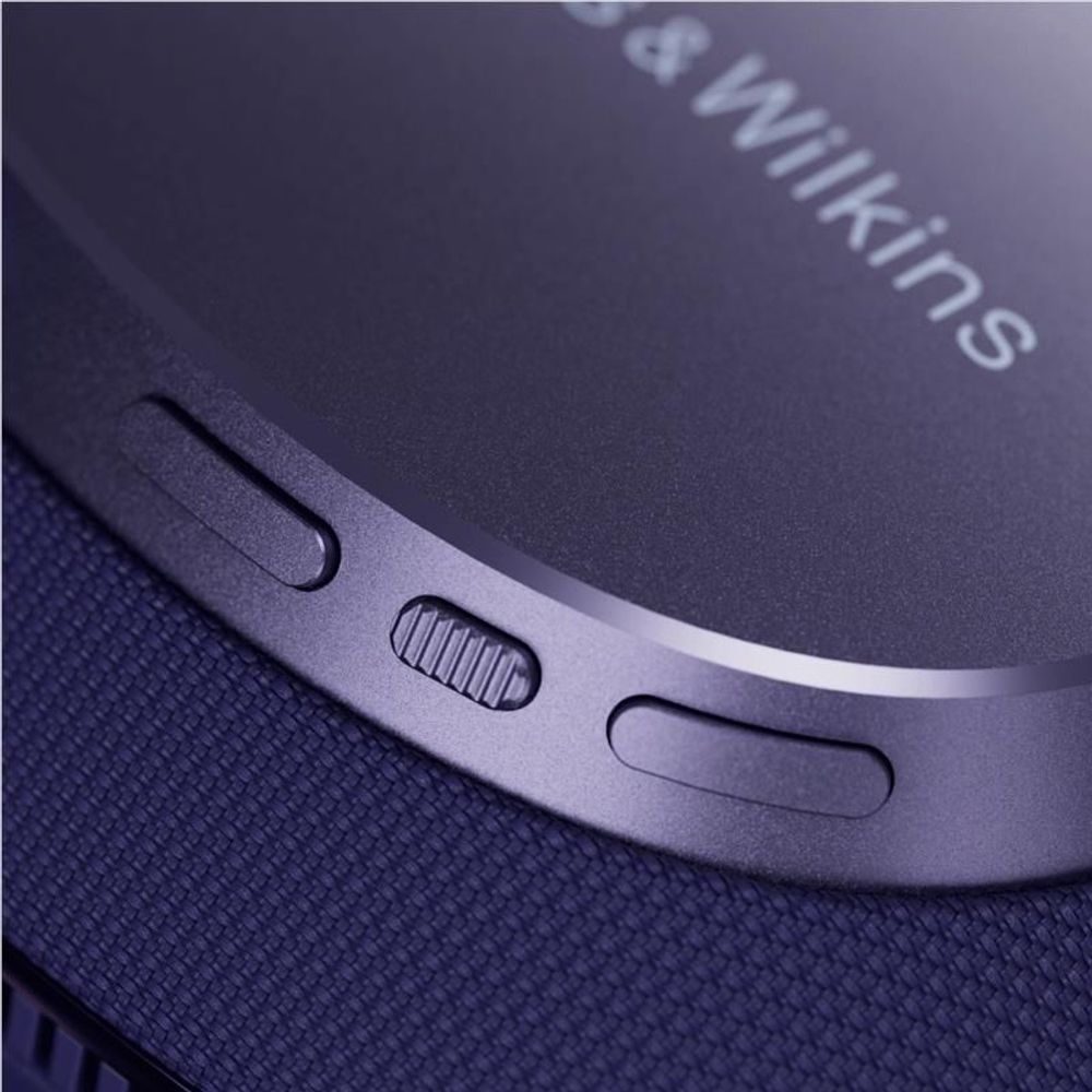 Indigo blue over-ear headphone earcup with control buttons and Bowers & Wilkins logo