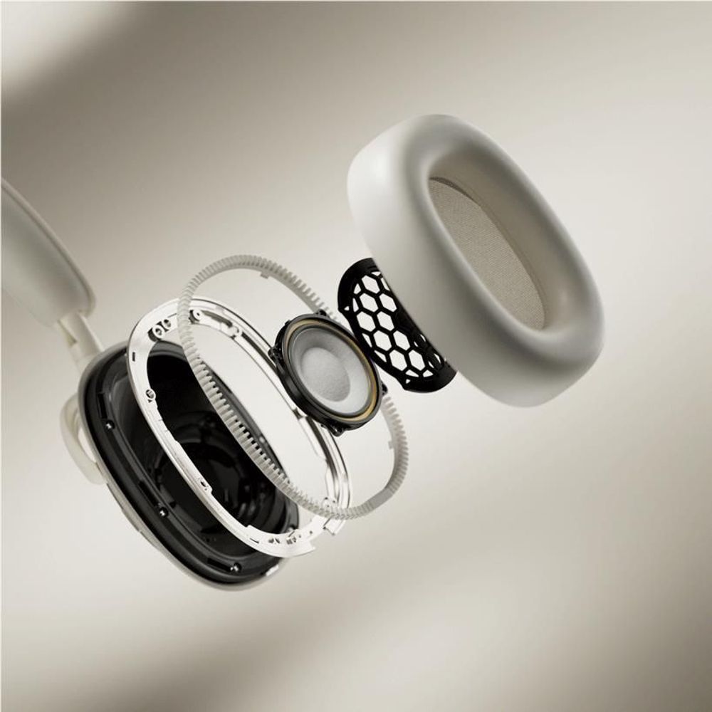 Disassembled canvas white ear cup components with speaker driver and grille.