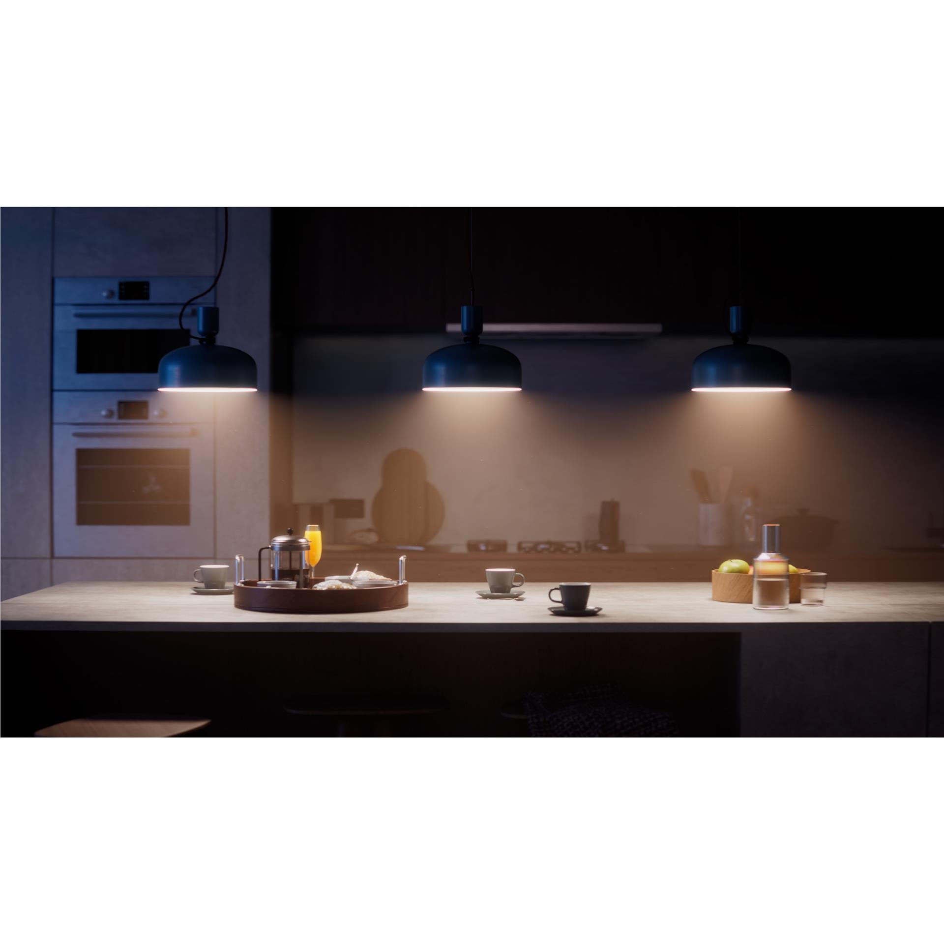 Warm white smart bulbs glowing over countertop