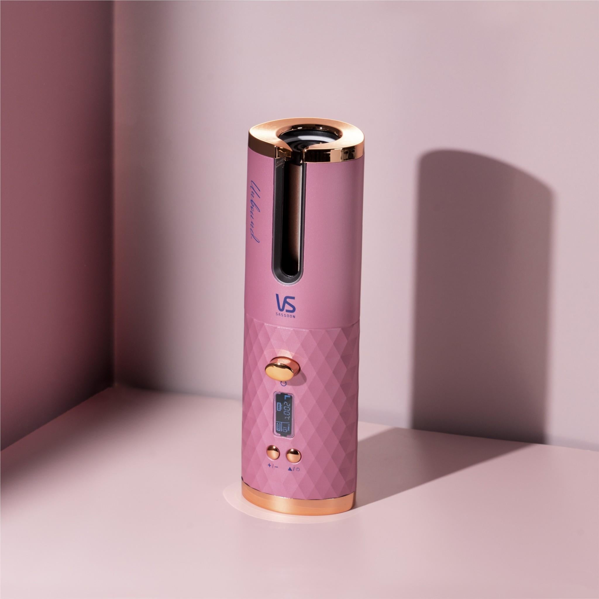 Pink cordless auto hair curler upright with gold top accents